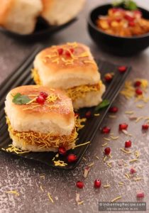 Spicy Kutchi Dabeli in a bun with pomegranate and sev